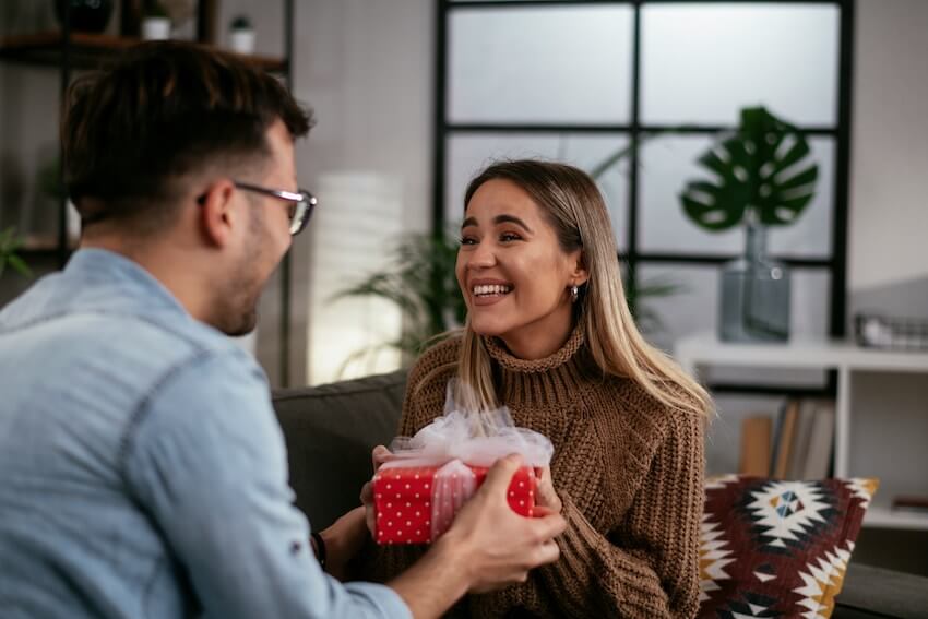 man giving a woman a gift