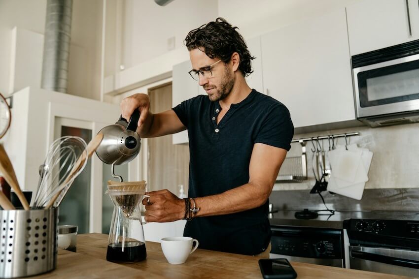 man making coffee at home