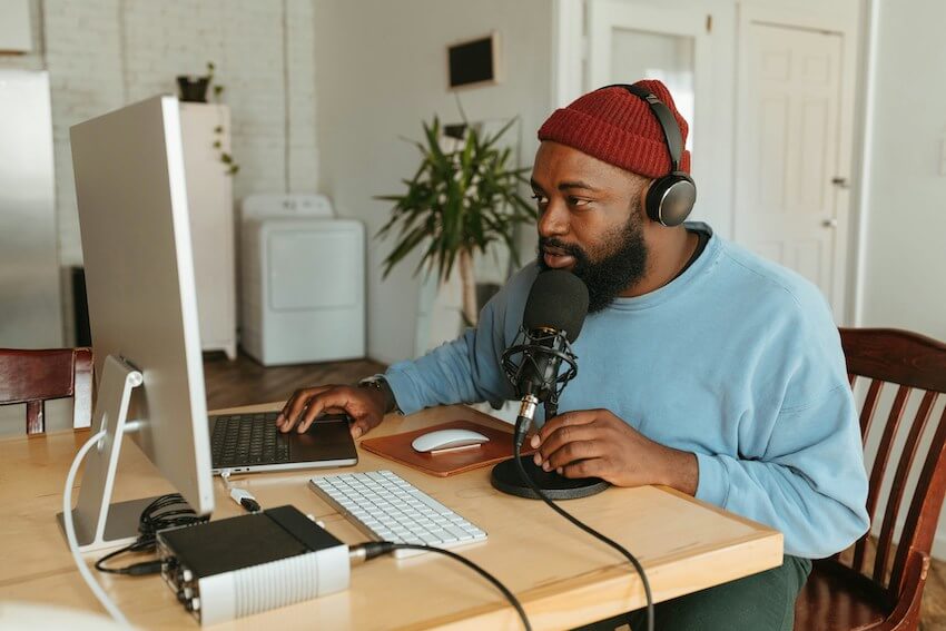 man using a professional microphone with computer
